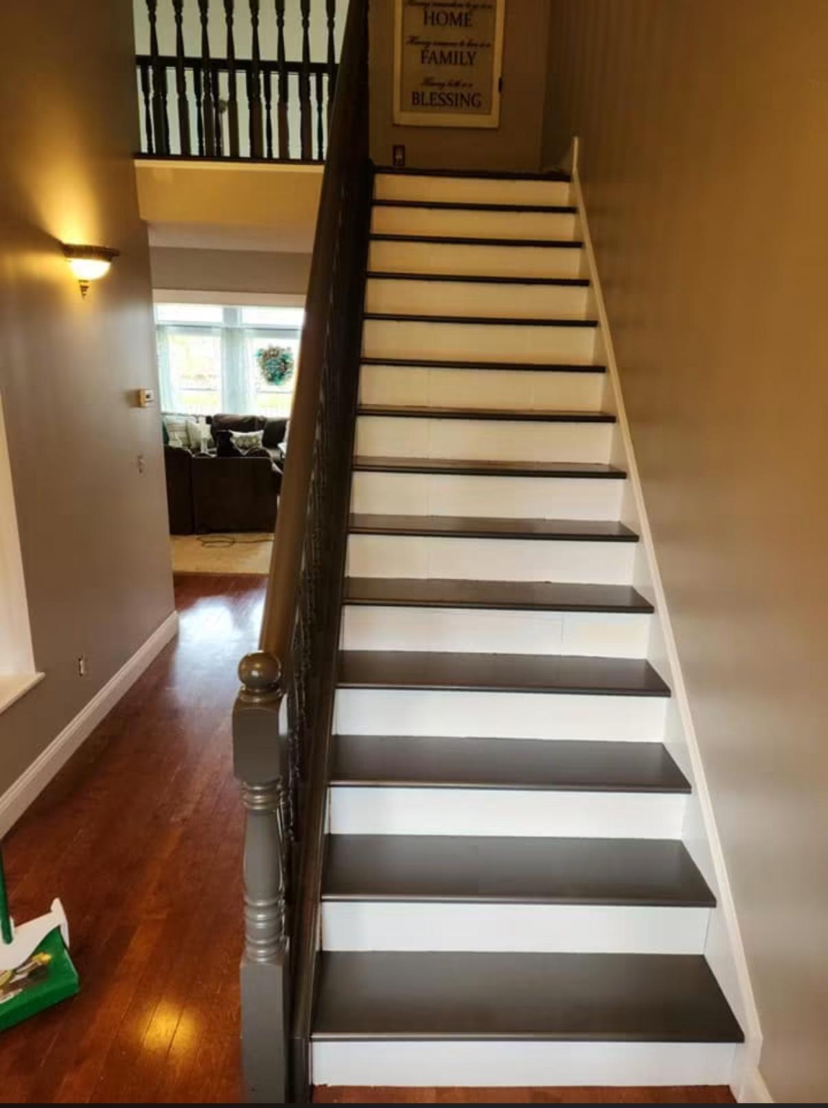 Staircase with painted dark treads and crisp white risers