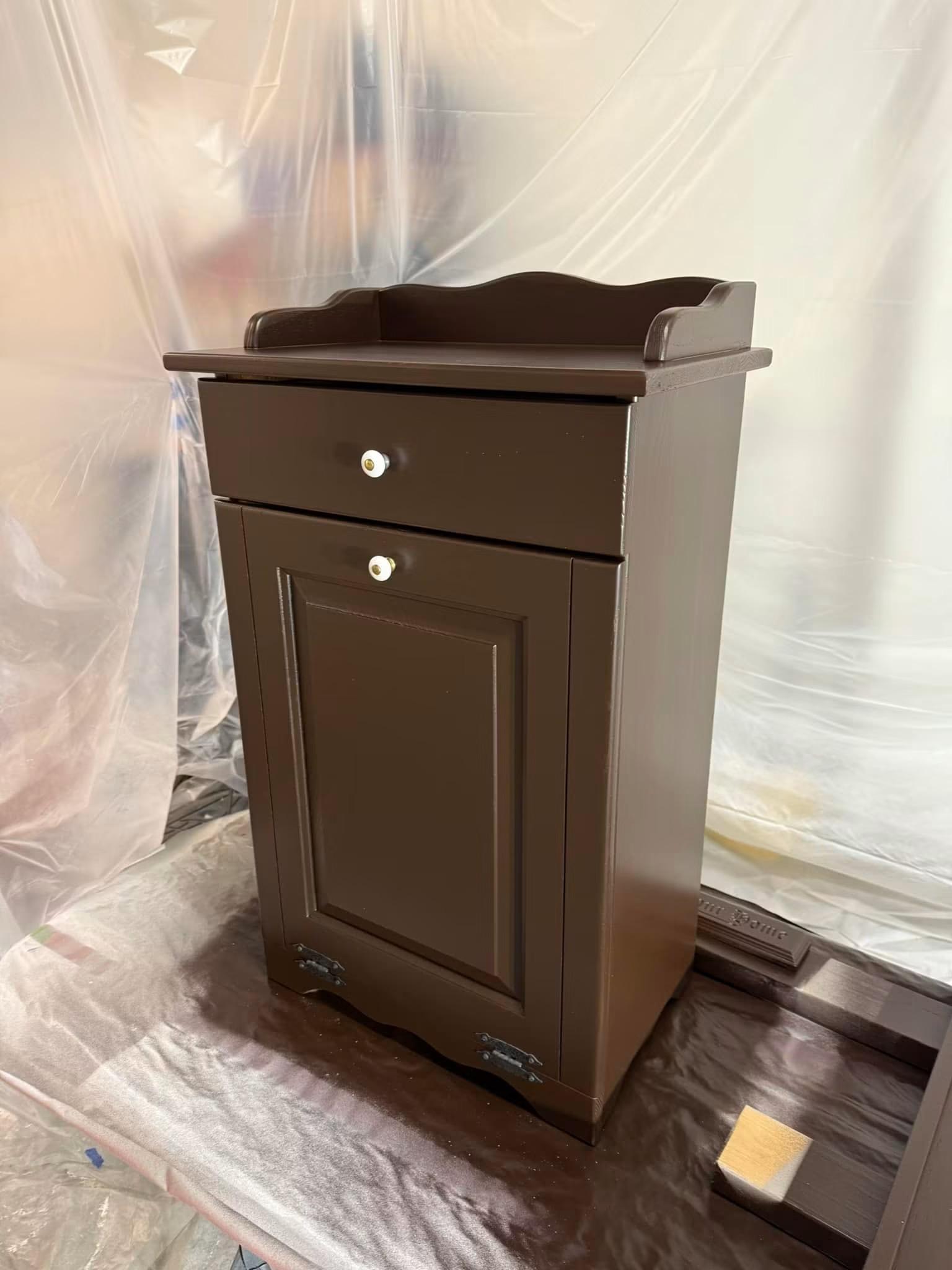 Small wooden side cabinet freshly painted a deep brown